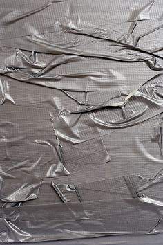 an aluminum foil background with various pieces of metal wire and wires on it stock photo