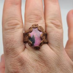 Lovely Swirls On This Copper Wire Wrapped Ring With Rhondenite Gemstone Sz 10.5 Pink Cabochon Ruby Ring Gift, Handmade Pink Oval Ruby Ring, Handmade Unique Pink Ruby Ring, Unique Handmade Pink Ruby Ring, Adjustable Pink Ruby Ring Gift, Pink Natural Stones Ring Jewelry, Adjustable Pink Ruby Ring, Pink Rings With Natural Stones For Gift, Wire Jewelry Rings