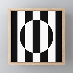 a black and white framed art print with an oval in the center on a gray background