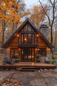 a log cabin in the woods surrounded by fall foliage