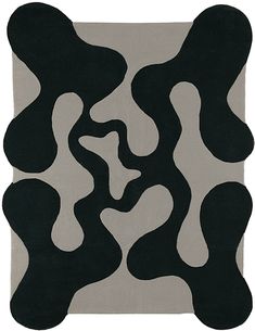 a black and white rug with wavy shapes