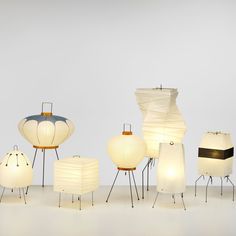 many lamps are arranged in rows on the floor, with one lamp turned upside down