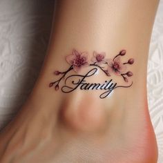 a woman's foot with the word family written on it and flowers around her ankles