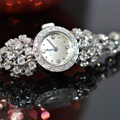 A Ladies Platinum (Stamped 950 Platinum) And Diamond 7 Inch Long Wristwatch By Vacheron & Constantin. The Wind Watch Has A V153 Swiss Made Movement With 17 Jewels And Is Adjusted To Temperature. There Are 134 Round Diamonds (Including 4 In The Dial) Having A Total Approximate Weight Of 4.68 Carats. The Round Off-White Dial Measures 14.75 Mm In Diameter And Is Surrounded By A Diamond Bezel. With The Movement Removed The Watch Weighs 21.28 Dwt. The Watch Has A Safety Chain. The Watch Has Been Full Anniversary Diamond Chronometer Watch, Luxury Brilliant Cut Wedding Jewelry And Watches, Evening Round Chronometer Watch, Evening Chronometer Round Watch, Round Chronometer Watch For Evening, Wedding Platinum Diamond Watch With 17 Jewels, Evening Chronometer Watch, Antique Platinum Evening Watches, Timeless Platinum Diamond Watch For Wedding