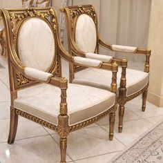 two chairs sitting next to each other on a tile floor