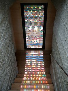 the floor is covered in multicolored tiles and there are stairs leading up to it