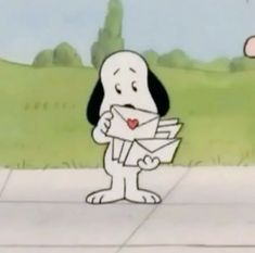 a cartoon dog holding a letter in its mouth