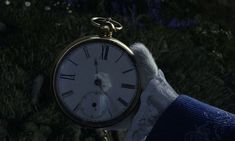 a person holding an old pocket watch in their hand with the hands on it's wrist