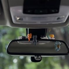 the rear view mirror has little figurines on it