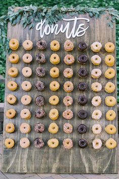 a wooden sign with donuts on it