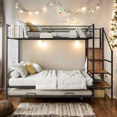 a bunk bed sitting in the middle of a living room next to a christmas tree