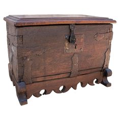 an old wooden chest with metal handles