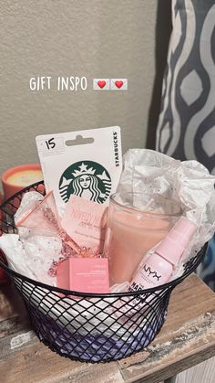 a basket filled with cosmetics and personal care items on top of a wooden table next to a pillow