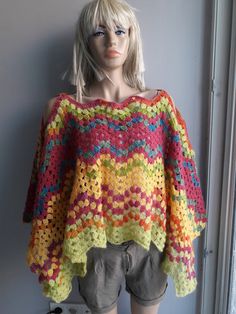 "It is refreshing with happiness to put on this cheerful poncho! It will warm you and make you happier with its beautiful colors and design. You may put on it with the wavy holes are on your shoulders or at the front and back: then the neckline will be boat neck or V neck respectively. Its dimensions allow you to fold it and use as a shawl or scarf in colder days. You may wrap it around your head and neck. Approximate dimensions when laid flat (folded): Height from shoulder down to hem edge: 48 Oversized Multicolor Poncho For The Beach, Oversized Multicolor Summer Poncho, Spring Multicolor Poncho For Beach, Casual Multicolor Summer Poncho, Spring Multicolor Beach Poncho, Spring Beach Multicolor Poncho, Multicolor Long Sleeve Poncho For The Beach, Multicolor Long Sleeve Poncho For Beach, Multicolor Poncho For Spring, One Size