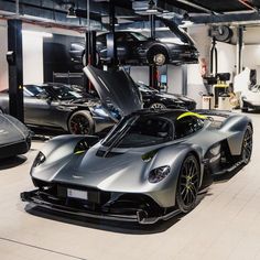 a silver sports car parked in a garage