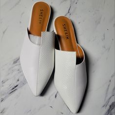 Color: White Size: Eur37 Super Classy! Step Into A World Of Contemporary Elegance With These Mules! These Shoes Redefine Sophistication With Their Striking Design And Sleek Silhouette. The Unique Irregular Detailing Adds An Avant-Garde Touch, Making Each Step A Statement Of Individuality. The Crisp White Hue Effortlessly Complements Any Outfit, From Casual Denim To Chic Dresses. The Point Toe Enhances The Modern Aesthetic, While The Mule Style Offers Easy Slip-On Convenience. Whether You're Atte Cheap Slip-on Pointed Toe Mules, Luxury Chic Slip-on Mules, Luxury Modern Slip-on Mules, Hermes Oz Mule White, Zebra Shoes, Denim Mules, Platform Crocs, Crocs Baya, Professional Shoes