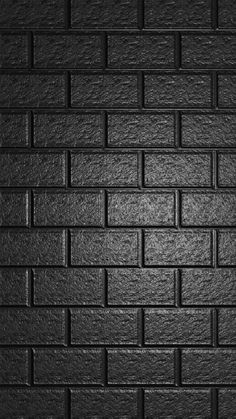 a black brick wall that is very dark