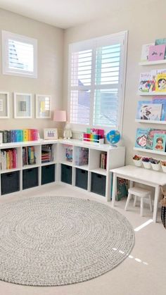 a child's playroom with bookshelves and toys