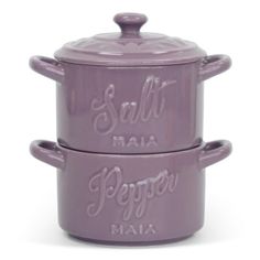 two purple pots sitting next to each other on top of a white surface with the words salt