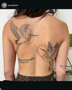 the back of a woman's body with tattoos on her upper and lower half