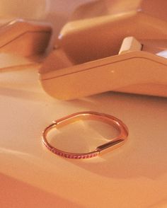 a gold ring sitting on top of a table