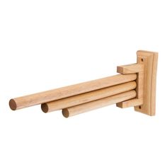 three wooden pegs are attached to the back of a coat rack, which is made out of wood