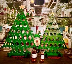 two christmas trees made out of liquor bottles