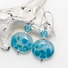 A pair of handmade artisan glass, Swarovski crystal and silver earrings. All metal parts are high quality sterling silver. They measure approx. 3.6cm long. All of the lampwork beads in my shop were made by me in my home studio in Sydney and have been annealed in my digital kiln to remove stress and prevent cracking. I do my best to take quality photos that show items clearly and as true to color as possible, however please understand that different computer monitors can display colors differentl Nickel-free Round Glass Jewelry, Clear Round Sterling Silver Earrings, Hypoallergenic Round Glass Jewelry, Hypoallergenic Round Glass Earrings, Nickel-free Turquoise Crystal Earrings For Gift, Handmade Glass Crystal Earrings For Gift, Nickel-free Clear Round Crystal Earrings, Turquoise Glass Round Jewelry, Turquoise Round Glass Jewelry