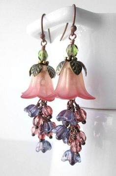 pink flower earrings with green leaves on them