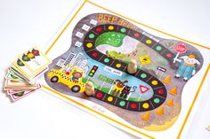 a game board with cars and people on it