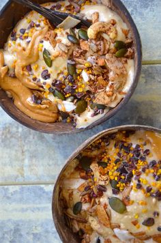 two bowls filled with dessert sitting on top of a table