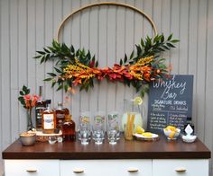 the bar is decorated with flowers and drinks