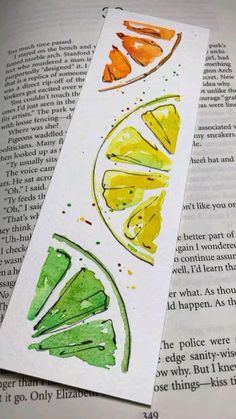 an open book with some watercolors on it and the words, lemon slices