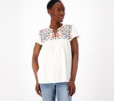 An intricate Southwest-inspired pattern gives this embroidered top its standout style. Pair it with capri jeans and flat sandals for a casual daytime look that exudes Bohemian charm. From Canyon RetreatTM. Casual Embroidered V-neck Top For Fall, Summer V-neck Top With Geometric Embroidery, Casual V-neck Blouse With Embroidered Neckline, Casual V-neck Blouse With Geometric Embroidery, Casual V-neck Embroidered Top With Multicolor Embroidery, Relaxed Fit Blouse With Floral Embroidery, Casual V-neck Top With Multicolor Embroidery, Spring Cotton Tops With Embroidered Hem, Casual Embroidered V-neck Top