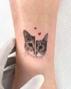 a cat's face is shown on the side of a woman's leg