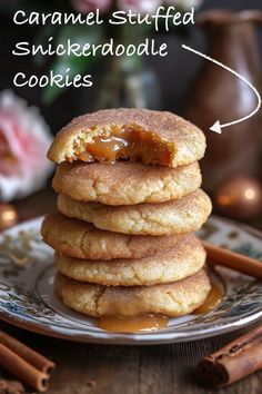 caramel stuffed snickkerdoodle cookies on a plate with cinnamon sticks in the background