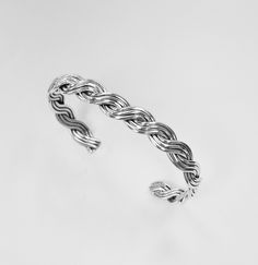 925 Sterling Silver Wire Braided Cuff bracelet Handcrafted 3 Strand wire by silver smith. Good quality, charming design. good for birthday, anniversary, Christmas gift made of : 925 Genuine sterling silver (Not silver plate, Nor silver coated) Size : 7, 71/2, 8 inch wrist. Weight : 15.3 g Sterling Silver Braided Bracelet With Silver Clasp Gift, White Gold Sterling Silver Braided Bracelet For Gifts, White Gold Sterling Silver Braided Bracelet As Gift, Handmade Silver Braided Sterling Silver Bracelet, Sterling Silver Braided Bangle Bracelet As Gift, Silver Sterling Silver Braided Bangle Bracelet, Sterling Silver Cuff Bracelet With Clasp As Gift, Sterling Silver Braided Bangle Bracelet, Braid Cuffs