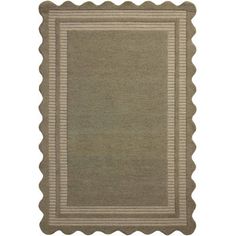 a beige rug with scalloped edges and a border in the middle on a white background