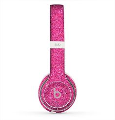 the bright pink glitter skin for the beats on - ear headphones, with an embellishment