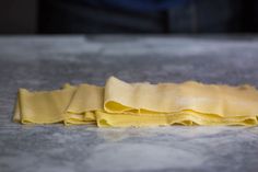 two pieces of uncooked pasta sitting on top of a counter