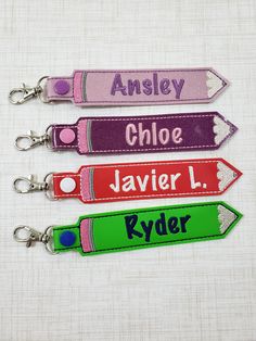 "Personalized Name Tag, customized name key fob, embroidered keychain, back to School, luggage Tag, backpack Label, Backpack Name, Backpack Name Tag for Kids, Teacher Gift. This pencil snap name tag can be personalized with any font color and 1 name or 3 initials. This tag is made from Vinyl. Please leave the name and font color you would like to be embroidered in the \"notes to seller\" during checkout. The embroidered pencil measures approximately 7.25 x 1.25 inches including the swivel clip. Customizable Rectangular Keychain For Everyday Use, Customizable Educational Craft Supplies For School, Customized Rectangular Keychains For School, Customizable Rectangular Keychains For Personalized Gifts, Customizable Rectangular Keychain For Personalized Gift, Customizable Rectangular Craft Supplies For Back To School, Customizable Craft Supplies For End Of School Year Gifts, Customized Multicolor Keychains For School, Rectangular Multicolor Keychains For School