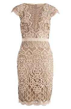 a women's dress with an openwork design on the front and back, in beige