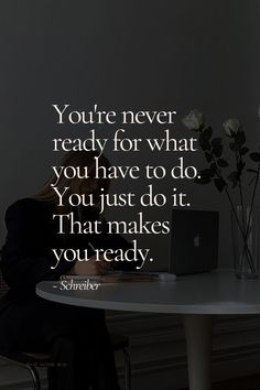 a woman sitting at a table with a laptop computer in front of her and the quote you're never ready for what you have to do