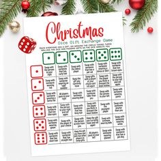 the christmas dice game printable is on top of a table with ornaments and decorations