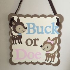 a sign that says buck or doe hanging on the wall next to a white wall