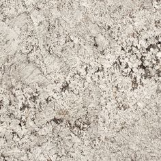 a close up view of a granite countertop with brown and white speckles