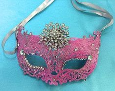 Eye catching masquerade mask sparkles with glitter and rhinestones. Perfect accessory for any formal costume. Wedding Masquerade Mask With Rhinestones, Carnival Rhinestone Masquerade Mask, Glamorous Masquerade Mask For Carnival, Masquerade Rhinestone Eye Mask, Glamorous Masquerade Mask For Carnival Evening, Glamorous Evening Masquerade Mask For Carnival, Mardi Gras Party Masks With Rhinestones, Rhinestone Mask For Carnival Masquerade, Rhinestone Mask For Masquerade Carnival