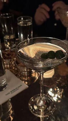 a close up of a martini glass on a table