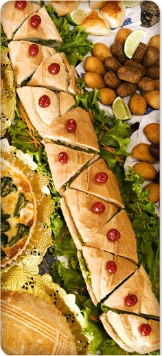 an assortment of food is displayed on a table