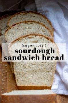 a loaf of sourdough sandwich bread sitting on top of a cutting board